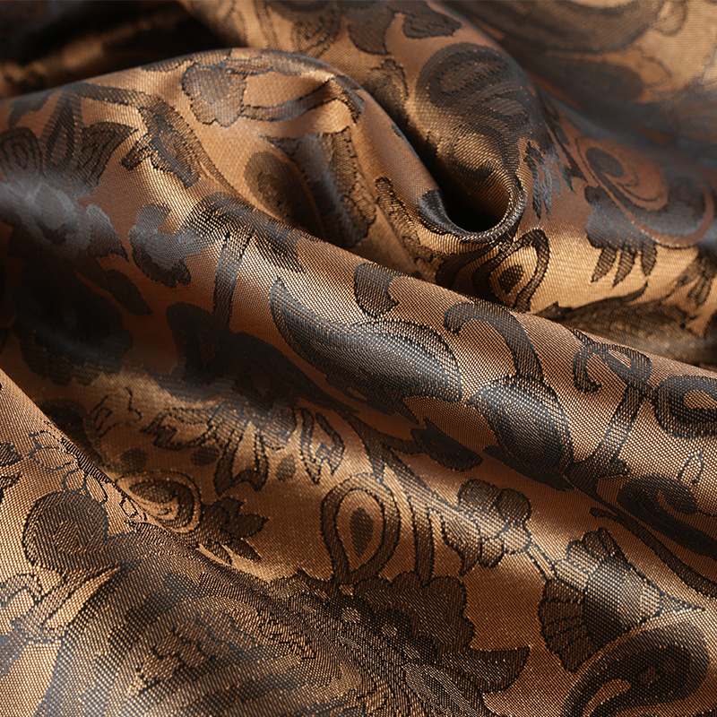 Jacquard med bågad lutblomma i polyester